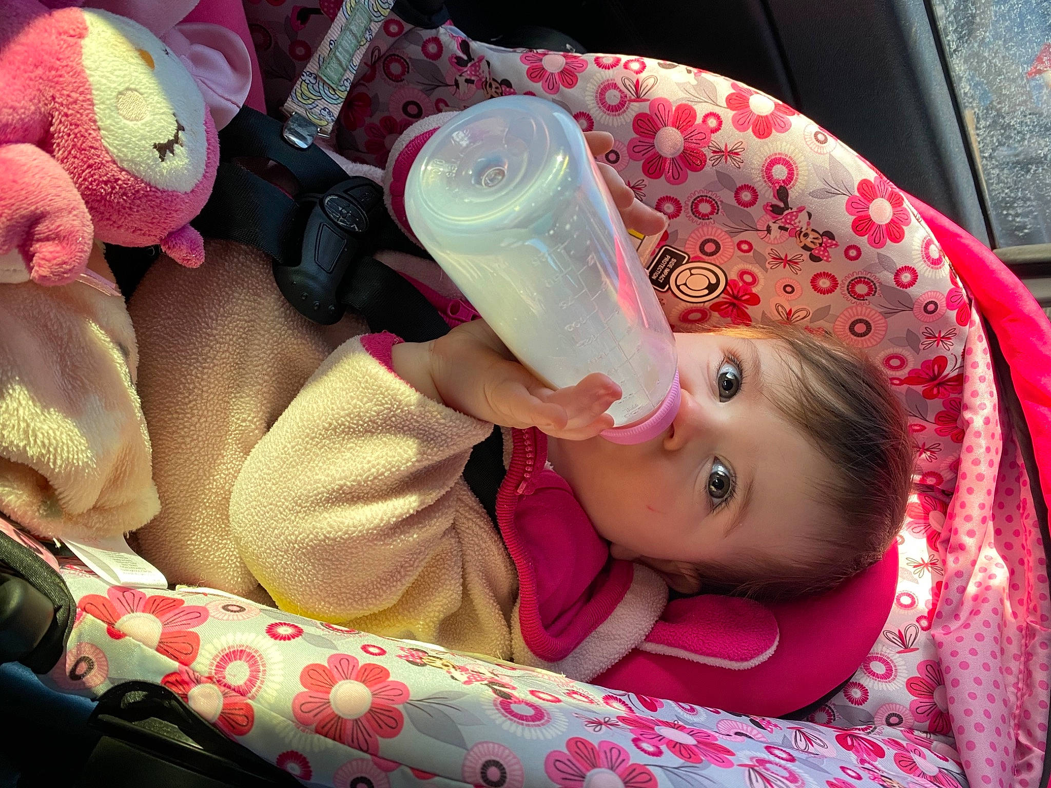 Justice joined the competition — help win amazing prizes! baby, car_seat, child, comfort, cool, drink, drinking, drinkware, eyelash, hand, lip, magenta, mouth, nail, person, pink, plastic_bottle, product, skin, toddler