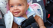 Kodiana joined the competition — help win amazing prizes! automobile, baby, blanket, brown_pants, car_interior, car_seat, child, close_up, clothing, floral_pattern, happy, infant, leopard_print, plush_toy, portrait, red_buckle, safety_harness, seatbelt, sitting, smiling
