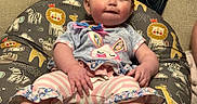 Valerica is registered to the contest to win money with this photo: animal_pattern, baby, blanket, bunny, child, colorful, couch, cushion, cute, furniture, gray, indoors, infant, person, pink, portrait, relaxed, smile, soft_toys, striped_pants