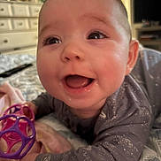 Valerica joined the competition — help win amazing prizes! baby, infant, smiling, toy, bed, pajamas, closeup, face, happy, child, indoors, furniture, blanket, play, cute, person, expression, home, room, sleepwear