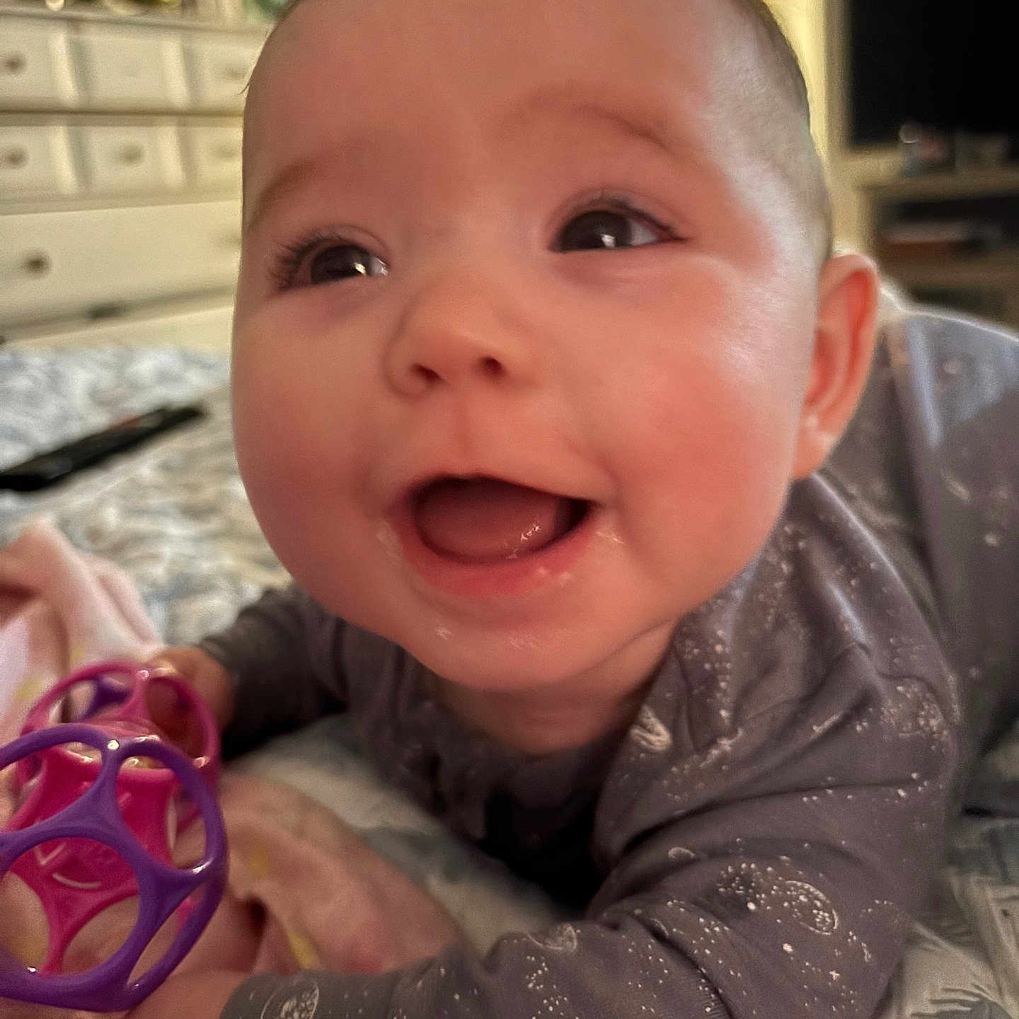 Valerica joined the competition — help win amazing prizes! baby, bed, blanket, child, closeup, cute, expression, face, furniture, happy, home, indoors, infant, pajamas, person, play, room, sleepwear, smiling, toy