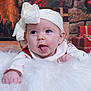 Valerica is registered to the contest to win money with this photo: baby, blanket, bow, child, christmas, cozy, cute, festive, fireplace, fluffy, headband, holiday, indoors, infant, portrait, presents, smiling, tongue_out, warm, white_clothing