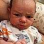 Ethan participe au concours pour gagner de l'argent avec cette photo : baby, infant, face, hand, onesie, clothing, tom_and_jerry, expression, fist, pattern, cushion, indoor, person, skin, head, eyes, hair, arm, closeup, cute