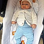 baby, infant, stroller, blanket, clothing, hat, footwear, cute, child, portrait, blue_pants, white_jacket, baby_shoes, face, hand, lying_down, indoor, comfort, expression, toddler