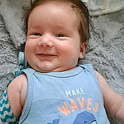 Samuel joined the competition — help win amazing prizes! baby, smiling, blue_clothing, whale, tank_top, blanket, soft_texture, infant, cute, happy, lying_down, child, face, hair, indoors, young_child, apparel, pattern, comfort, portrait