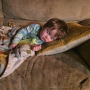 Samuel is registered to the contest to win money with this photo: blanket, bottle, child, clothing, comfort, couch, cozy, face, hair, home, indoor, nap, person, pillow, relaxing, rest, sleeping, soft, toddler, young_child