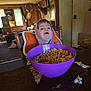 Samuel joined the competition — help win amazing prizes! child, hoodie, cereal, purple_bowl, table, wooden_chair, indoor, cabin, deer_mounts, window, box, door, carpet, toy, snack, face, person, food, breakfast, rustic