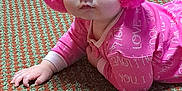 Zamara joined the competition — help win amazing prizes! baby, child, pink, earmuffs, pajamas, carpet, floor, indoor, person, hand, face, crawling, pattern, home, cute, clothing, infant, people, legs, socks