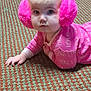 baby, child, pink, earmuffs, pajamas, carpet, floor, indoor, person, hand, face, crawling, pattern, home, cute, clothing, infant, people, legs, socks