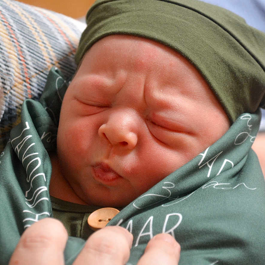 Zayden joined the competition — help win amazing prizes! baby, bodypart, bonnet, cap, clothing, face, finger, glove, hand, hat, head, newborn, person, photography, portrait, sleeping