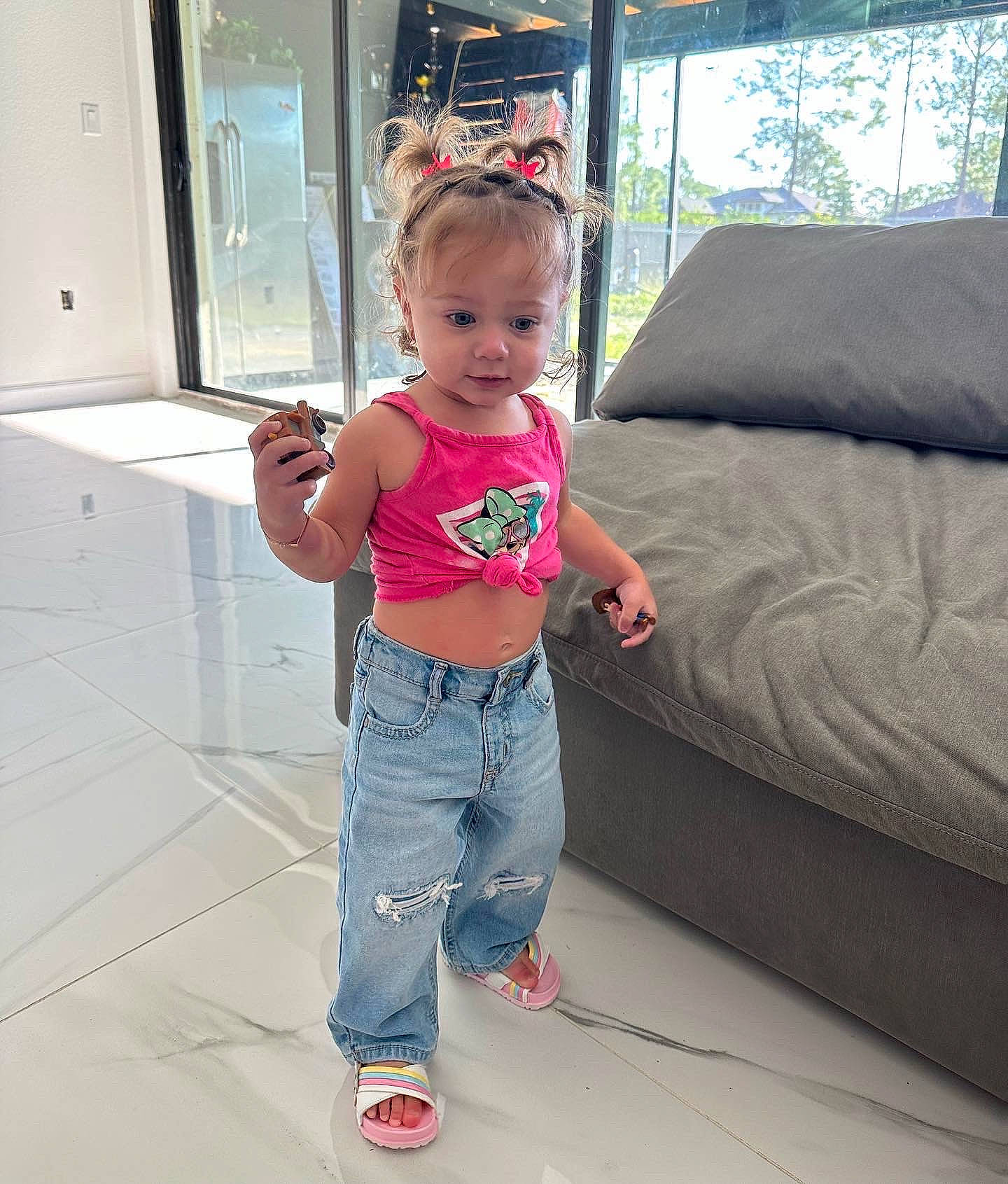 Kylie joined the competition — help win amazing prizes! baby_toddler_clothing, comfort, couch, floor, flooring, fun, happy, human_leg, jeans, knee, leg, leisure, magenta, person, sleeve, sofa_bed, studio_couch, t_shirt, thigh, toddler