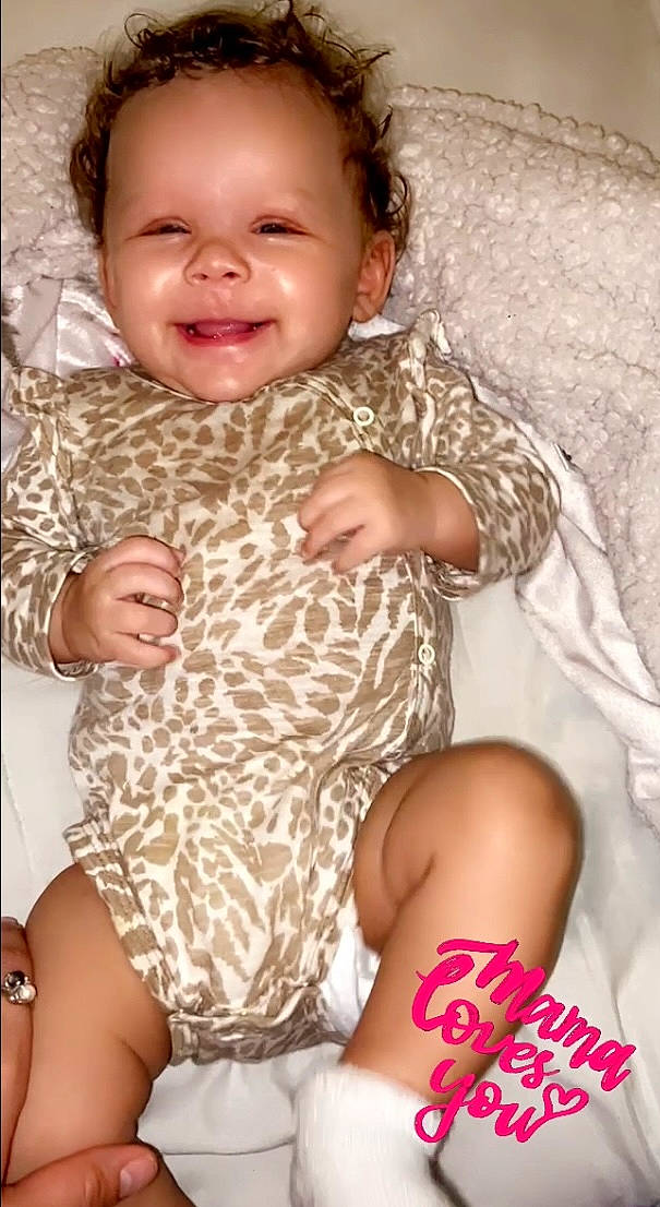 Symphanie is registered to the contest to win money with this photo: baby_toddler_clothing, cheek, chin, clothing, comfort, eye, face, hair, head, human, human_body, joint, joy, leg, muscle, neck, nose, organ, person, skin