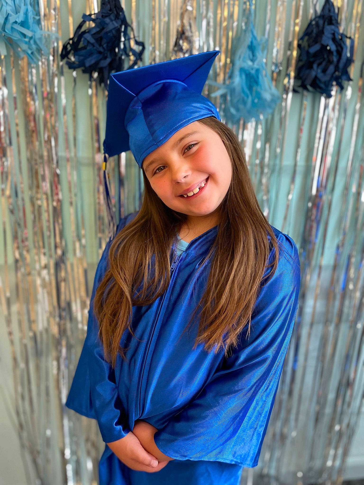 Peyton is registered to the contest to win money with this photo: academic_dress, academic_institution, blue, clothing, electric_blue, event, eye, fashion_design, fun, graduation, happy, headgear, headwear, joy, long_hair, mortarboard, outerwear, person, phd, scholar