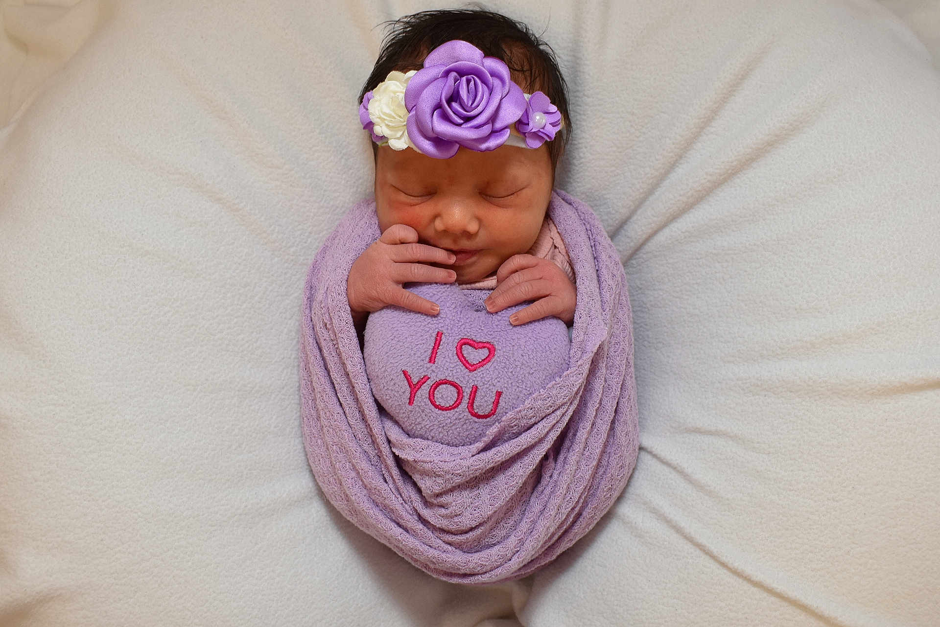 Rosie joined the competition — help win amazing prizes! newborn, baby, infant, wrapped, blanket, plush, heart, purple, headband, flowers, sleeping, cute, soft, cozy, love, hands, portrait, peaceful, resting, toddler