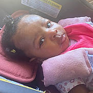 Aamyla joined the competition — help win amazing prizes! baby, blanket, car_seat, child, clothing, curly_hair, cute, expression, face, head_support, indoor, infant, person, pink, portrait, resting, safety, seatbelt, soft_texture, young_child