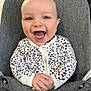 baby, child, smiling, happy, onesie, leopard_print, infant, seat, cushion, grey, hands, open_mouth, blue_eyes, cute, portrait, indoor, clothing, young_child, joyful, person
