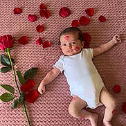 Seyyed a rejoint le concours — aidez-le/la à gagner de superbes lots ! baby, newborn, infant, onesie, blanket, pink_blanket, rose, rose_petal, petals, kiss_mark, lipstick, lying_down, portrait, cute, soft_texture, plant_stem, leaves, skin, barefoot, indoor