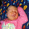 Lillian joined the competition — help win amazing prizes! newborn, baby, sleeping, infant, portrait, face, pink, polka_dots, onesie, blanket, bed, indoors, peaceful, resting, closed_eyes, raised_arm, floral_pattern, colorful, fishing_lures, fan