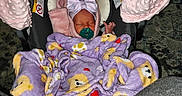 Lillian joined the competition — help win amazing prizes! newborn, baby, infant, sleeping, car_seat, blanket, bow, pacifier, purple, pink, teddy_bear, bundled, portrait, indoors, cozy, seated, headband, textile, child, photography