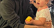 Serenity joined the competition — help win amazing prizes! adult, beard, carpet, child, fairy_lights, family, floor, glasses, holding, hugging, indoor, living_room, man, pajamas, surprised_expression, sweater, television, toddler, toy, yellow_toy