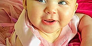 Liz Angeli is registered to the contest to win money with this photo: baby, child, smile, pink_dress, headband, flower, portrait, happy, cute, infant, closeup, face, cheeks, eyes, skin, soft_light, tulle, sitting, adorable, young