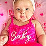 Liz Angeli is registered to the contest to win money with this photo: baby, child, pink, headband, flower, dress, tongue, cute, blanket, heart, smiling, portrait, infant, clothing, fabric, face, person, closeup, happy, toddler