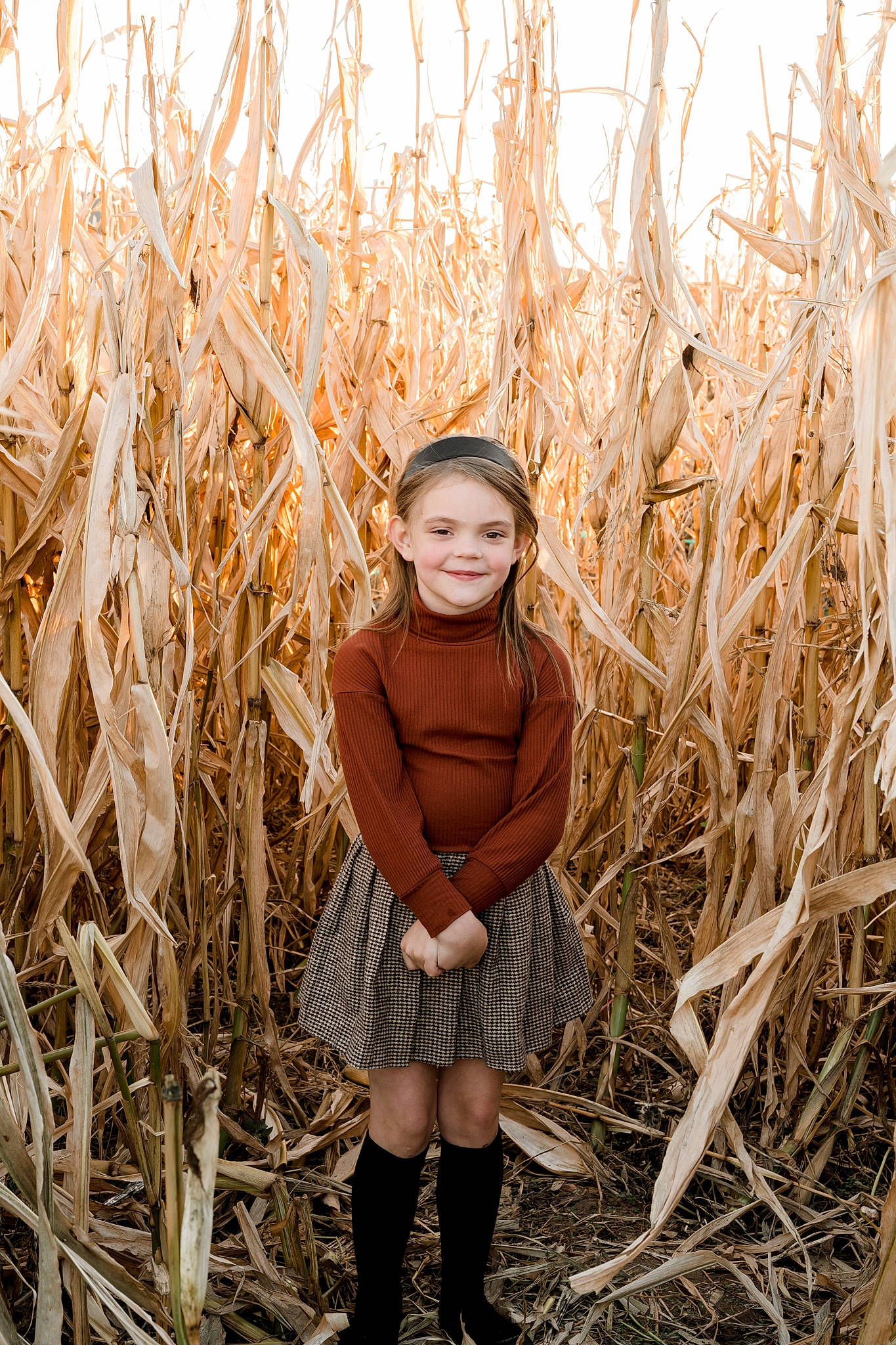 Emilia is registered to the contest to win money with this photo: agriculture, blond, boot, brown_hair, facial_expression, field, fun, grass, grass_family, grassland, happy, hat, human_leg, joy, people_in_nature, person, plant, prairie, sky, sunlight