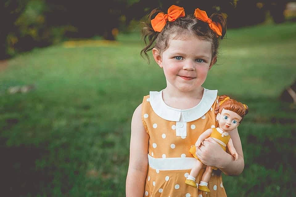 Alyssa Jo is registered to the contest to win money with this photo: child, dress, eye, face, fawn, flash_photography, fun, grass, happy, head, iris, joy, lawn, leisure, pattern, people_in_nature, person, plant, smile, summer