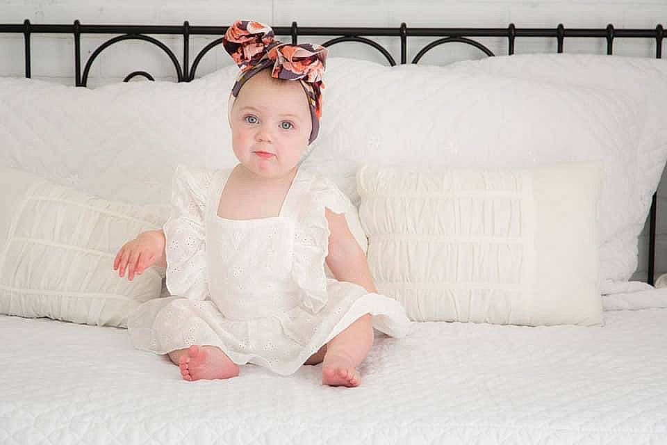 Bailey joined the competition — help win amazing prizes! arm, bridal_accessory, comfort, couch, day_dress, dress, embellishment, fashion_accessory, fashion_design, flash_photography, flooring, happy, head, headpiece, headwear, human_leg, jewellery, neck, person, skin