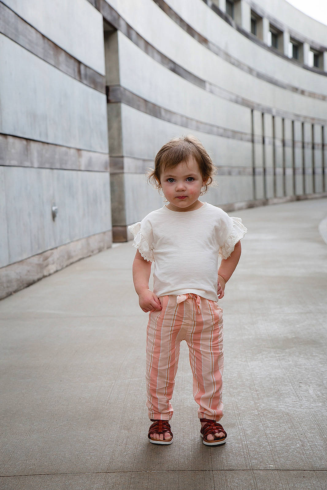 Bailey is registered to the contest to win money with this photo: baby_toddler_clothing, child, denim, facial_expression, flooring, fun, grey, hairstyle, happy, monochrome, monochrome_photography, pattern, person, portrait_photography, sleeve, standing, symmetry, toddler, vacation, walking