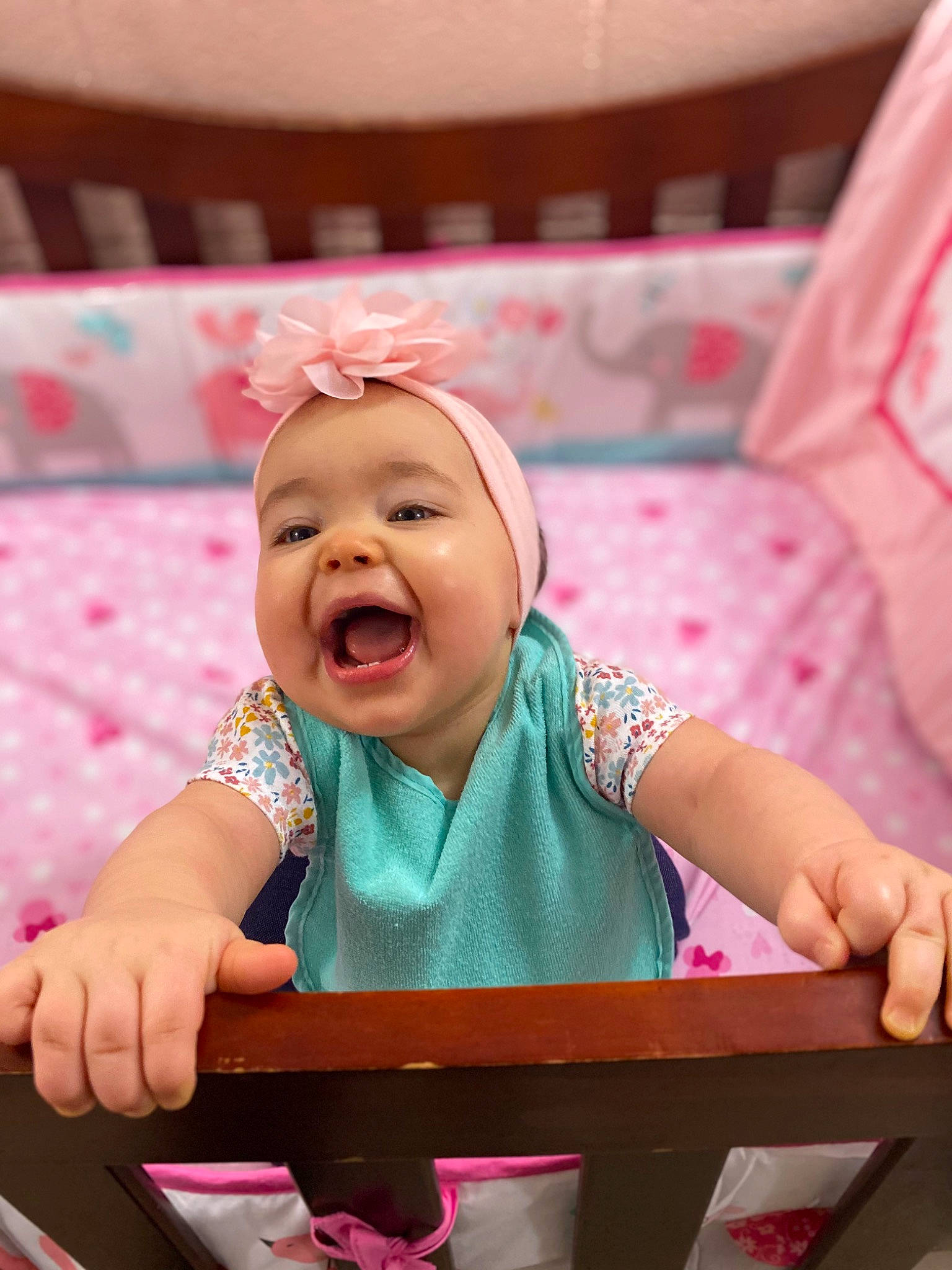 Valorie is registered to the contest to win money with this photo: baby, baby_laughing, baby_products, baby_toddler_clothing, cheek, child, comfort, event, finger, fun, happy, headwear, leisure, magenta, person, pink, play, sitting, skin, smile