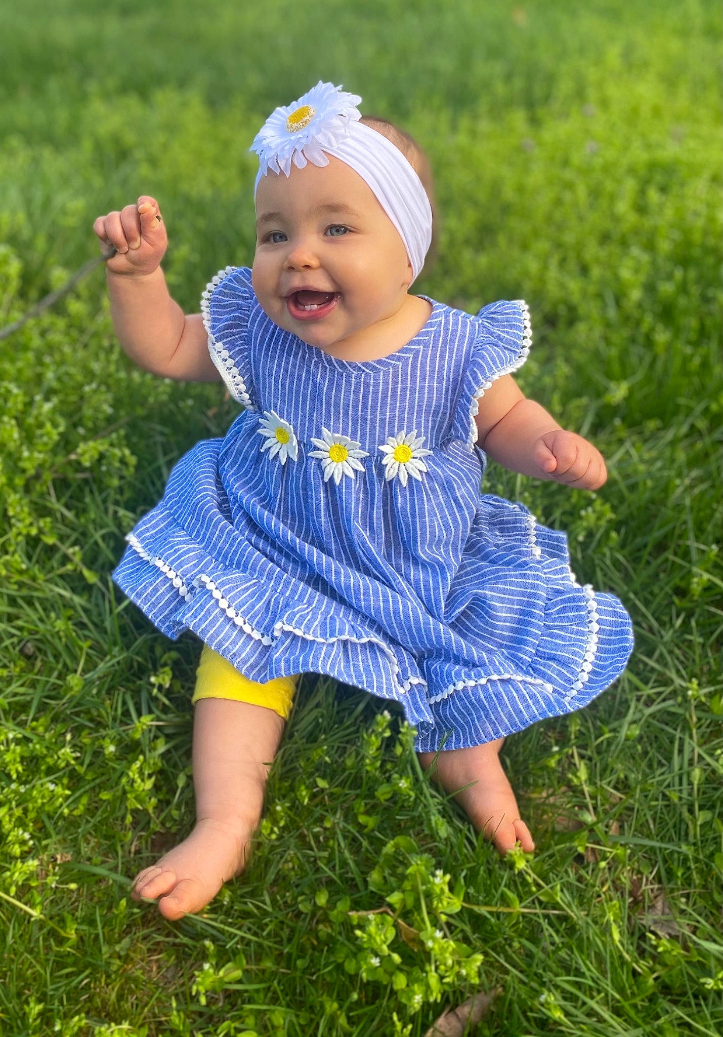 Valorie is registered to the contest to win money with this photo: azure, baby, baby_toddler_clothing, child, clothing, electric_blue, fun, grass, happy, headwear, leaf, meadow, people_in_nature, person, photograph, plant, purple, skin, smile, summer