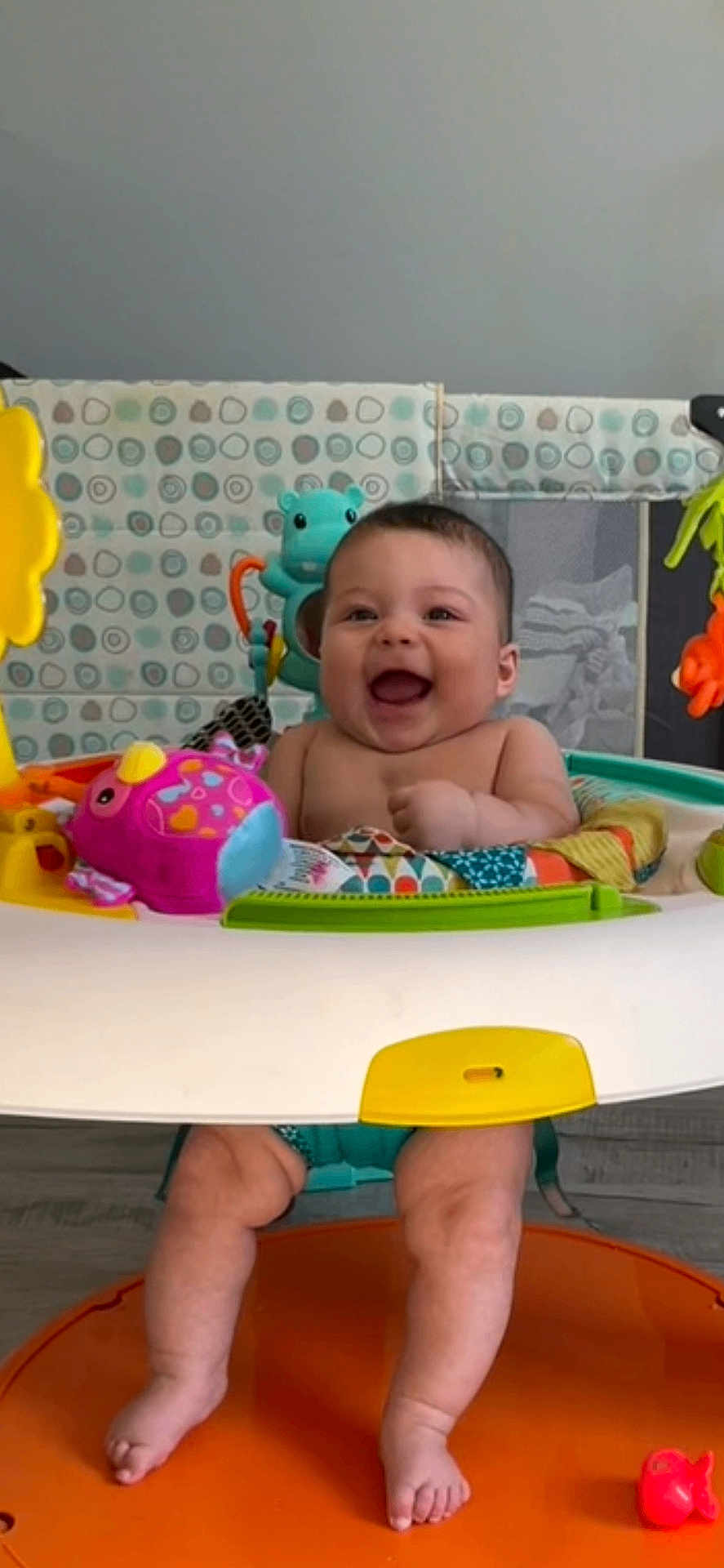 Avery is registered to the contest to win money with this photo: baby, child, smile, happy, toy, activity_center, colorful, indoor, legs, feet, playtime, infant, face, sitting, fun, cute, cheerful, development, early_childhood, bright