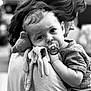 baby, pacifier, plush_toy, adult, shoulder, black_and_white, portrait, close_up, comfort, child, toddler, emotion, cuddly, face, hair, clothing, indoor, person, holding, expression