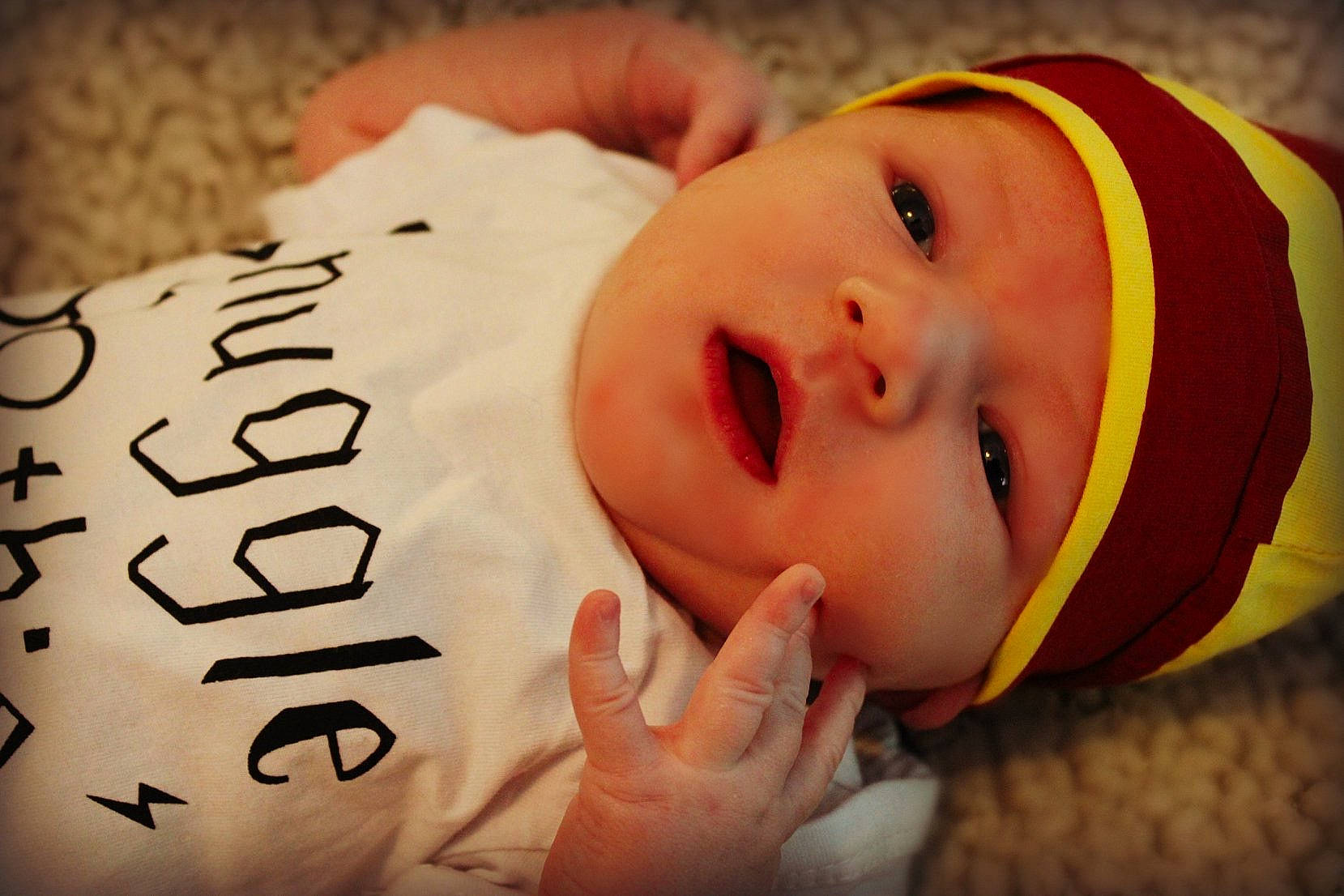 Beckett is registered to the contest to win money with this photo: baby, bedtime, cheek, child, face, facial_expression, happy, head, headgear, headwear, lip, mouth, nose, person, skin, smile, toddler, yellow