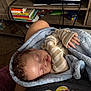 baby, sleeping, blanket, infant, cozy, fingers, face, home, furniture, books, sleeps, child, peaceful, curled_hand, indoors, person, resting, soft, casual, toddler