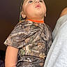 Ryland joined the competition — help win amazing prizes! toddler, child, camouflage, clothing, hat, person, indoor, portrait, baby, young_child, looking_up, casual_wear, short_sleeves, human, skin, headwear, hand, arm, holding, curious_expression