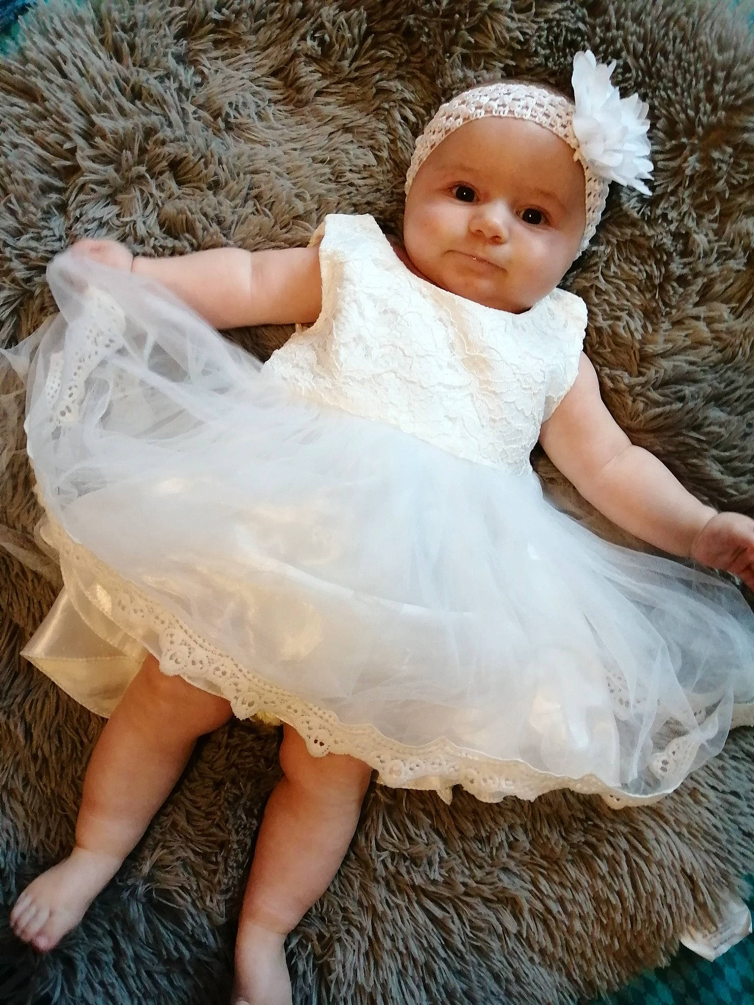 Lindsay participe au concours pour gagner de l'argent avec cette photo : baby, baby_toddler_clothing, beauty, bridal_accessory, day_dress, dress, embellishment, eye, flash_photography, happy, head, headgear, headpiece, headwear, iris, person, photograph, pink, skin, sleeve