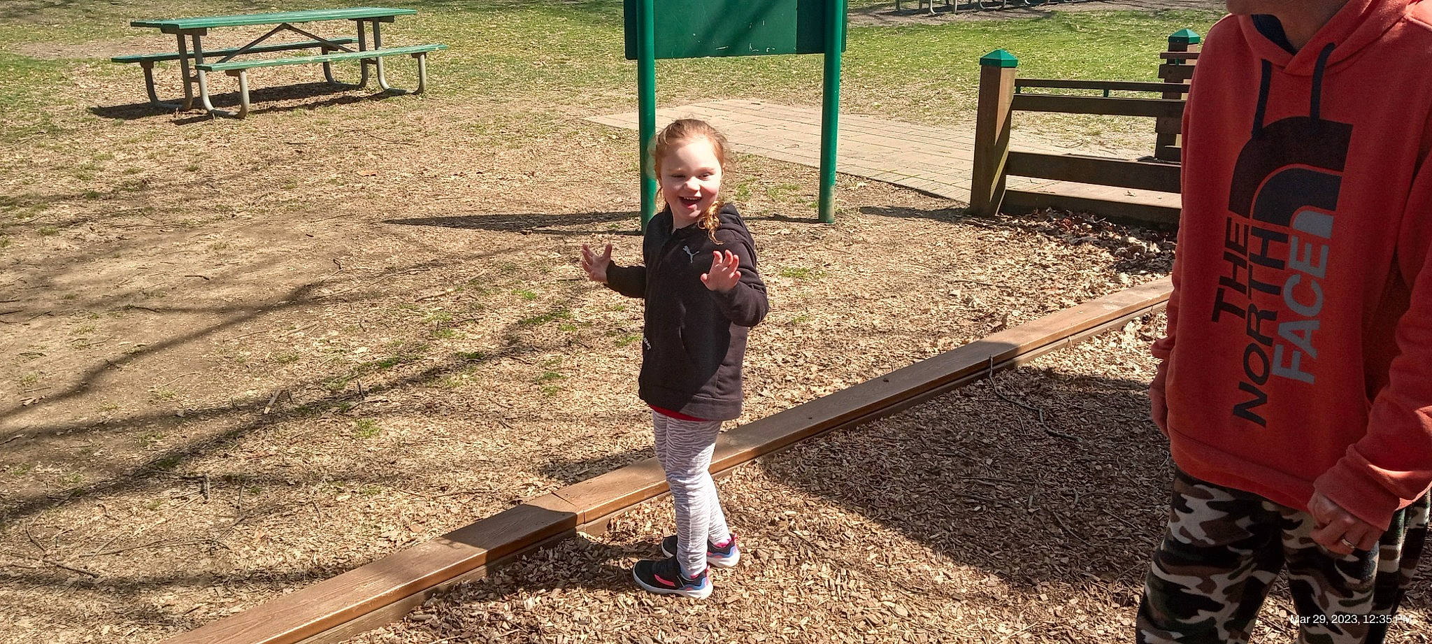 Nicole is registered to the contest to win money with this photo: baby, baby_toddler_clothing, child, city, fun, grass, green, joy, leisure, outdoor_play_equipment, people_in_nature, person, play, playground, public_space, recreation, shade, smile, soil, toddler