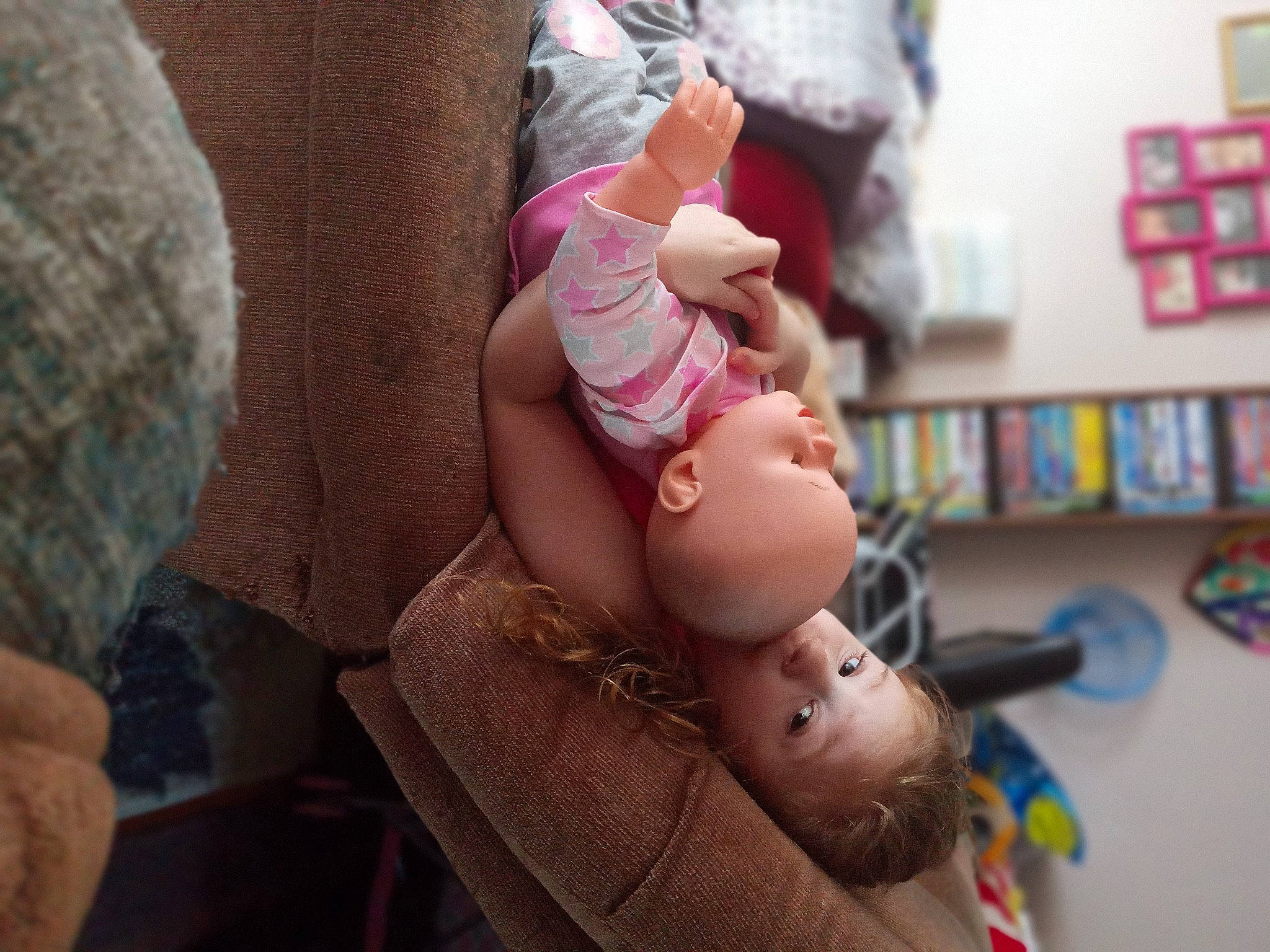 Nicole is registered to the contest to win money with this photo: baby, baby_products, cheek, child, ear, eyelash, finger, fun, happy, human_leg, mouth, nail, person, pink, play, room, shelf, sitting, skin, toddler