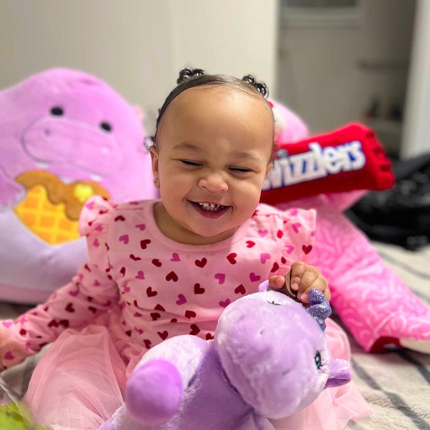 Aurora is registered to the contest to win money with this photo: baby, babylaughing, bodypart, cushion, face, happy, head, homedecor, laughing, mouth, person, photography, plush, portrait, purple, sitting, smile, teddybear, teeth, toy