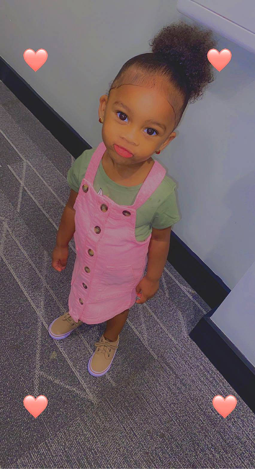 Jmaris is registered to the contest to win money with this photo: baby, baby_toddler_clothing, cheek, child, eyelash, face, flooring, gesture, hair, hairstyle, head, lip, magenta, pattern, person, pink, skin, sleeve, thumb, toddler