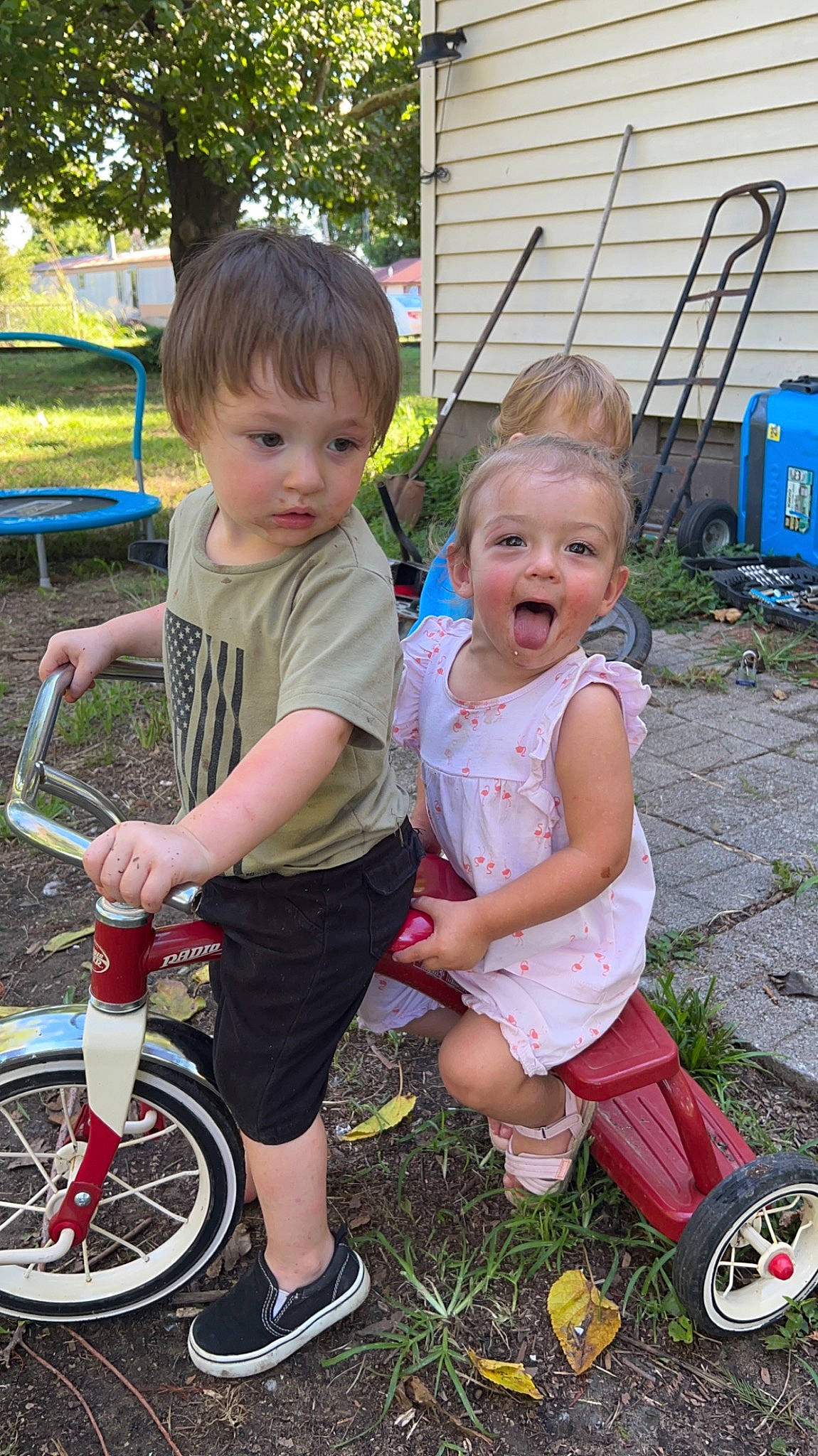 Bailie is registered to the contest to win money with this photo: bicycle, bicycle_frame, bicycle_handlebar, bicycle_tire, bicycle_wheel, bicycles_equipment_and_supplies, child, facial_expression, fun, grass, green, happy, leisure, people_in_nature, person, photograph, pink, shorts, tire, toddler