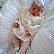 Alexis-Paige joined the competition — help win amazing prizes! baby, infant, white_blanket, headband, bow, pink_pants, pastel_colors, lying_down, textured_blanket, soft_lighting, cute, newborn, portrait, clothing, indoors, child, small_hands, peaceful, resting, fabric