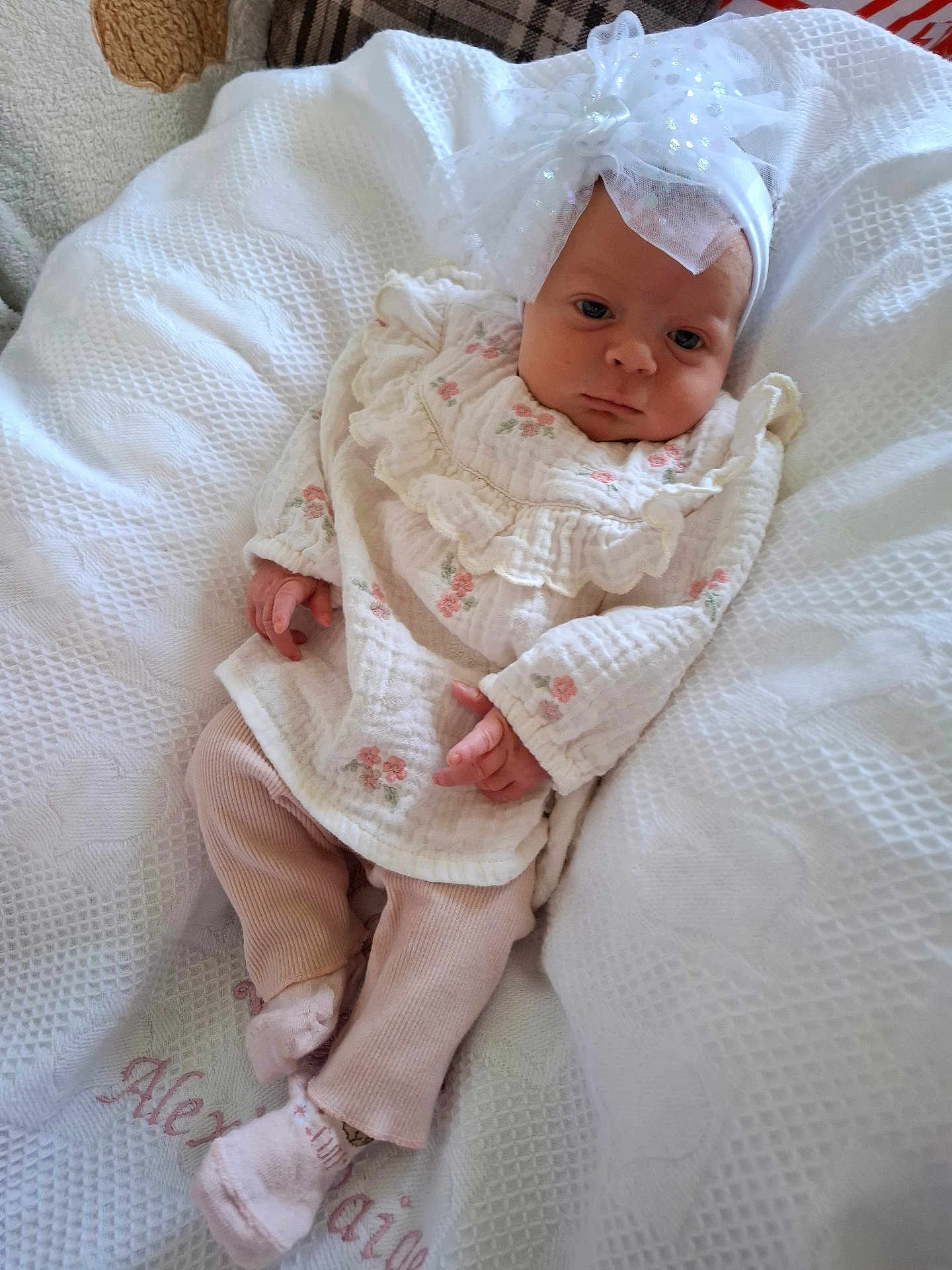 Alexis-Paige joined the competition — help win amazing prizes! baby, infant, white_blanket, headband, bow, pink_pants, pastel_colors, lying_down, textured_blanket, soft_lighting, cute, newborn, portrait, clothing, indoors, child, small_hands, peaceful, resting, fabric