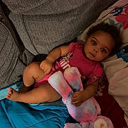 Kamira joined the competition — help win amazing prizes! baby, blanket, child, colorful, couch, cushion, dark_lighting, home, indoor, infant, lying_down, pink_clothing, plush_toy, portrait, relaxed, sitting, sofa, stuffed_animal, teddy_bear, wide_eyed