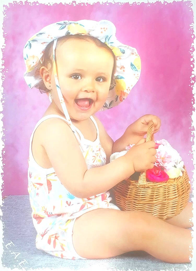 Olivia a rejoint le concours — aidez-le/la à gagner de superbes lots ! baby, baby_toddler_clothing, basket, child, clothing, fashion_accessory, fun, happy, hat, human_leg, magenta, pattern, person, pink, play, purple, smile, textile, thigh, toddler