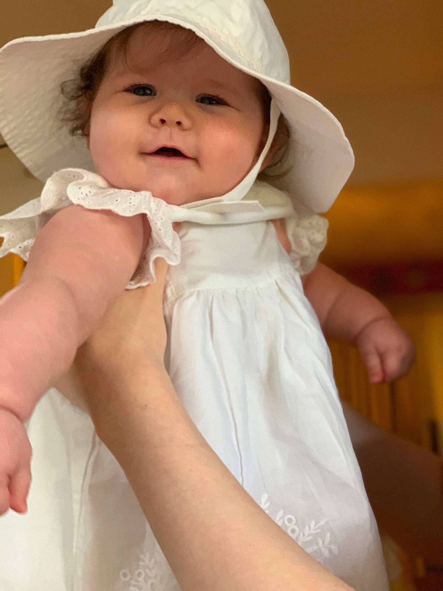 Arden joined the competition — help win amazing prizes! baby, bonnet, child, finger, hand, headgear, headwear, person, skin, smile, toddler