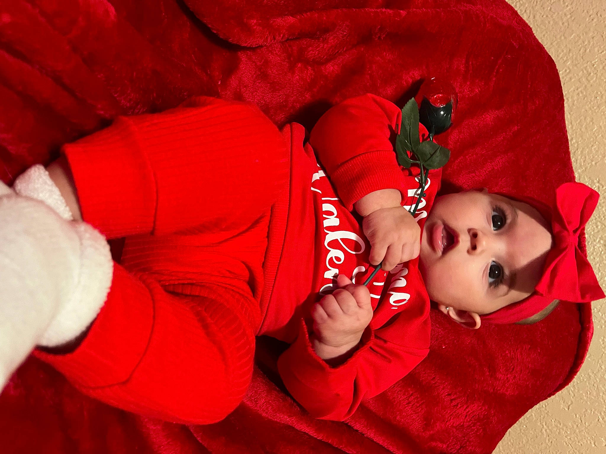 Valeria is registered to the contest to win money with this photo: baby, baby_toddler_clothing, carmine, child, comfort, fictional_character, flash_photography, fur, gesture, happy, hat, headwear, human_body, human_leg, knee, magenta, person, red, sleeve, textile