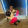 toddler, child, mirror, reflection, carpet, crawling, indoor, clothing, pink_shorts, light_shirt, black_socks, hairstyle, curious, baby, face, room, lighting, sparkly_frame, self_discovery, cute